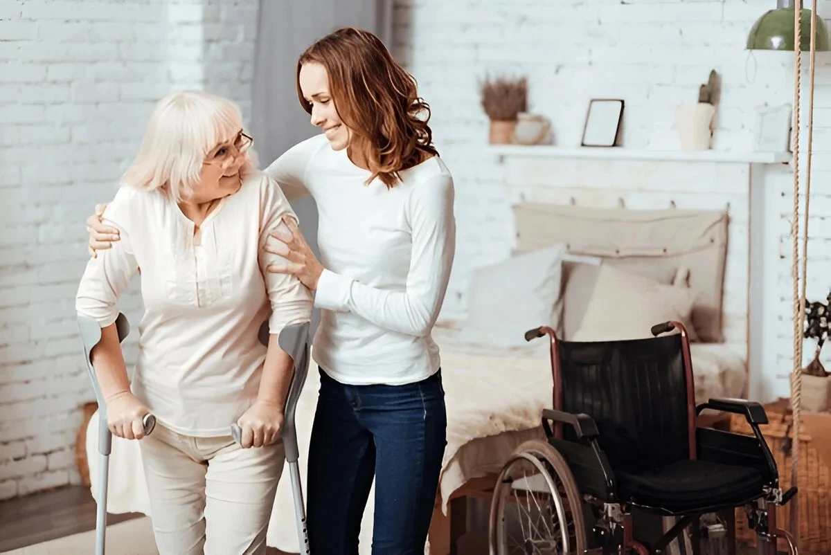 Elderly woman receiving support at home from caregiver – Home Care Packages, Iconic Care Group Australia, Campbelltown NSW